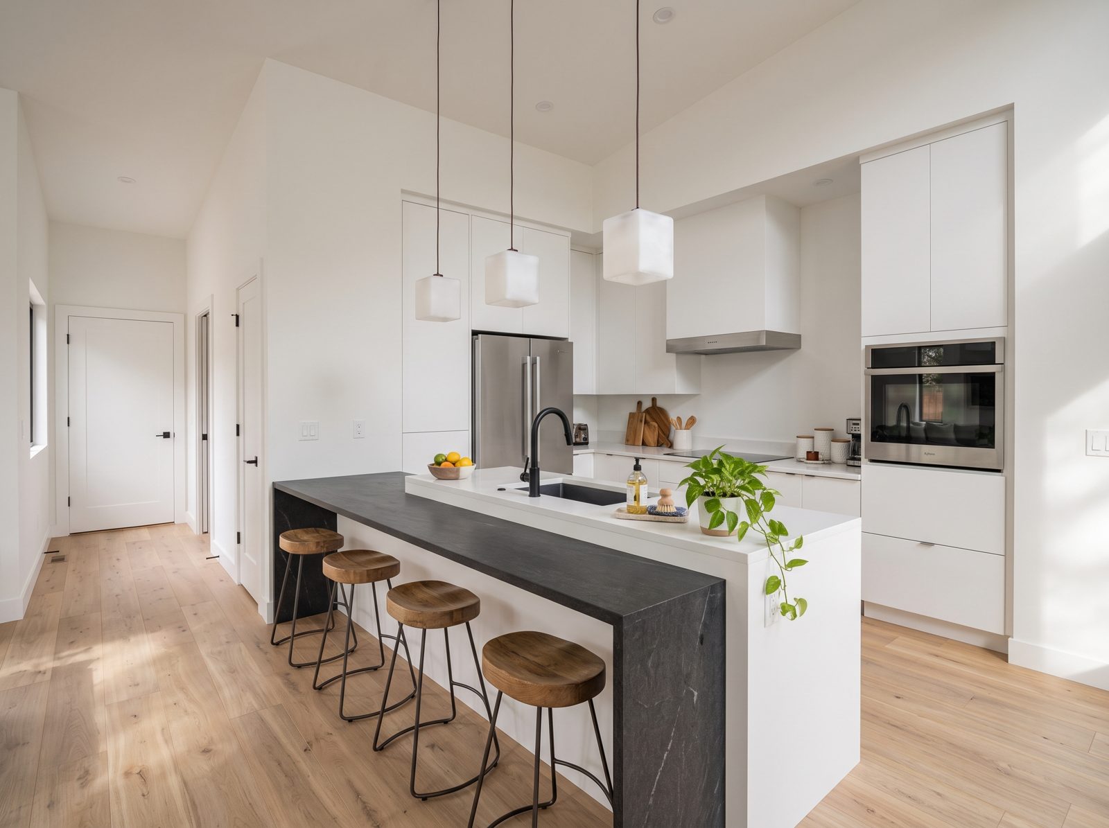Cascade Cottage concept rendering: kitchen with waterfall island and pendant lights