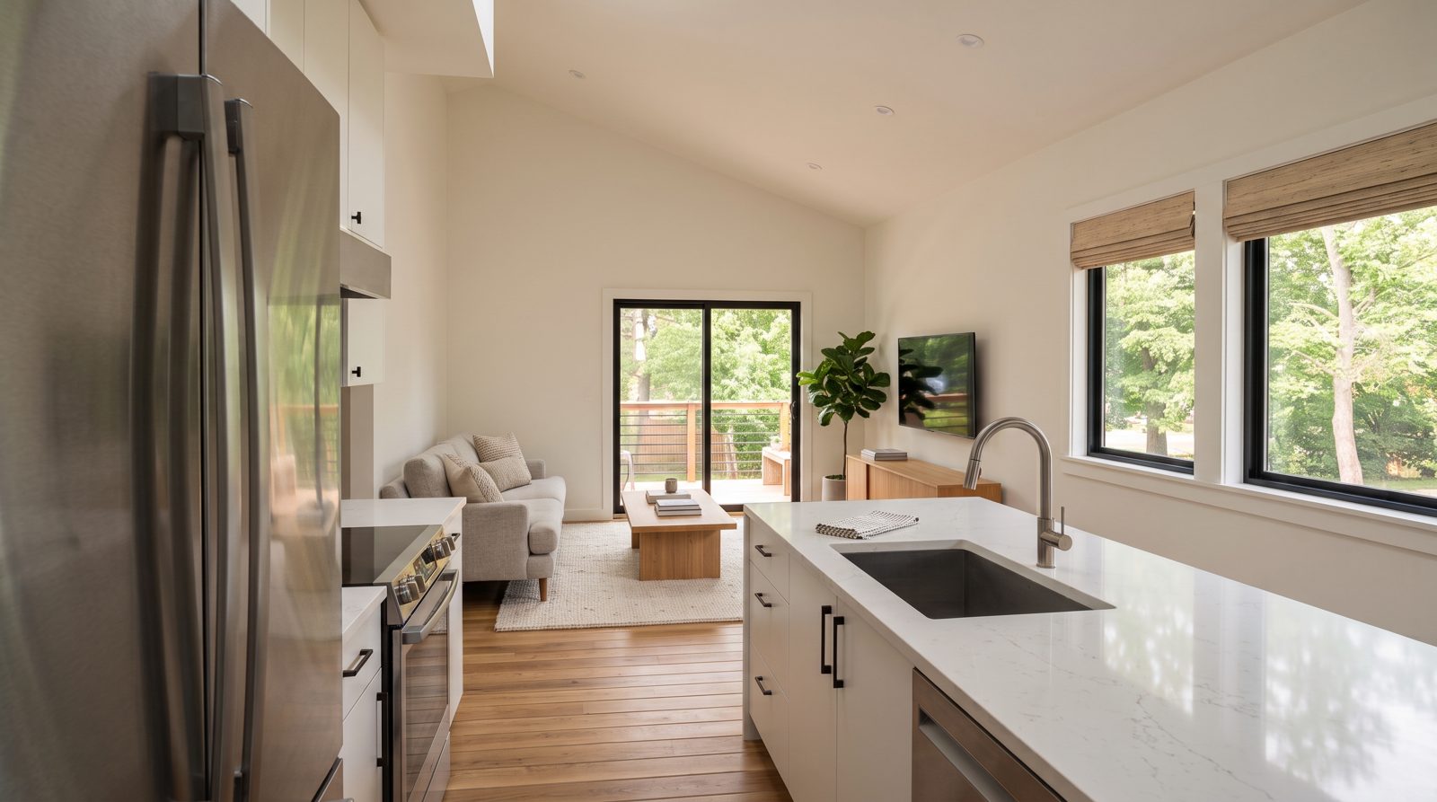 Mt. Bachelor Pad concept rendering: upstairs living room seen from the kitchen island, with the deck beyond